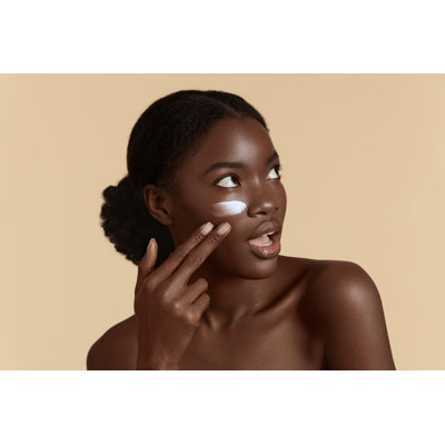 Durella Girl Applying Cream - Wrapped Canvas Print