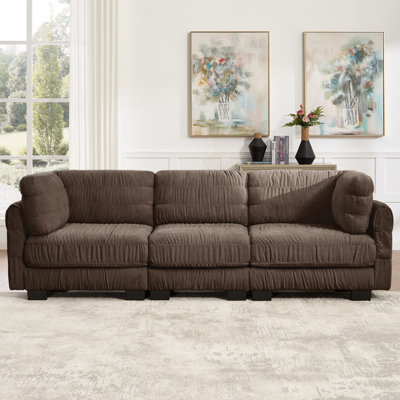 Canapé d'angle modulaire avec détails froncés sur l'assise