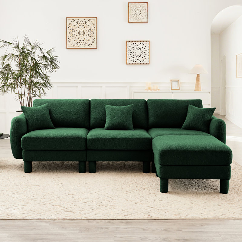 Tissu à 3 boucles avec dossier élégamment incurvé, amovible et doux pour un canapé relaxant. Configuration élégante des pieds cylindriques.