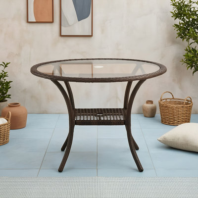 Table extérieure en résine avec plateau en verre trempé