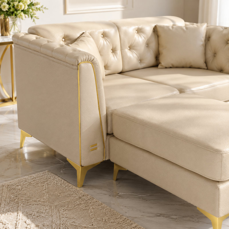 Canapé modulaire en similicuir Riner avec capitonnage à boutons et garniture en métal Riner, Beige White