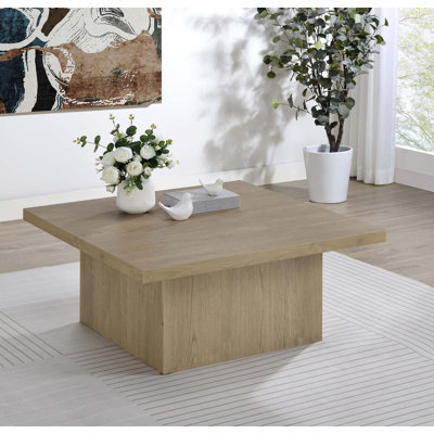 Table basse moderne carrée avec motif sculptural