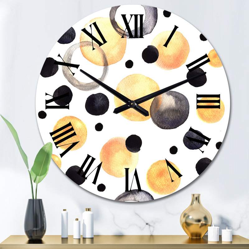 Horloge murale à motifs noirs et jaunes sur fond blanc, Moyen
