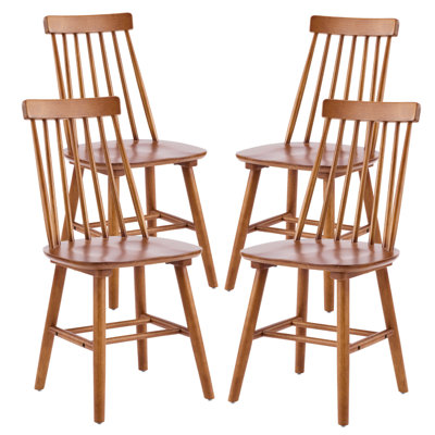 Ensemble de quatre chaises d'appoint à dossier Windsor en bois de noyer massif