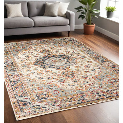 Tapis tissé à la machine médaillon ivoire et bleu marine 5 pi x 8 pi