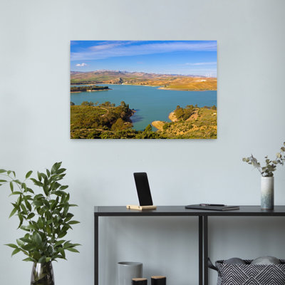 View Across Guadalhorce Dam, Malaga Province, Andalusia, Spain, To Farmland And Wind Turbines Beyond. Embalse De Conde De Guadalorce. Abstract Cont...