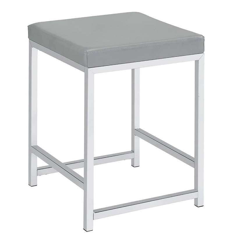 Tabouret de coiffeuse gris rembourré avec base élégante en similicuir