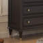 Armoire cinq tiroirs en bois massif noir avec pattes décoratives dorées