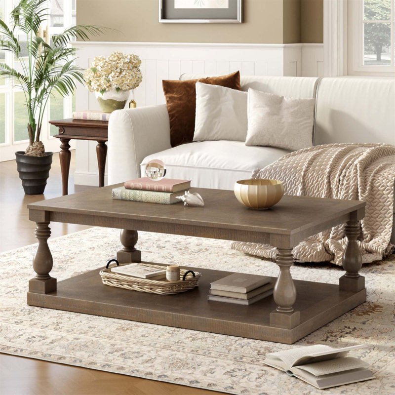 Table basse rétro avec pieds de colonne en vase artistique et placage de pin luxueux, parfaite pour les salons et les salles d'étude