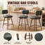 Tabourets de bar Nidovia 63,5 cm (25 po) de hauteur comptoir, pivotants à 360°, dossier bas, revêtement en similicuir, assise rembourrée, pieds en métal et repose-pieds.-2069176735-2069176728
