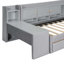 Lit de jour simple tapissier avec tiroirs, tablettes, armoires rabattables et table d'appoint