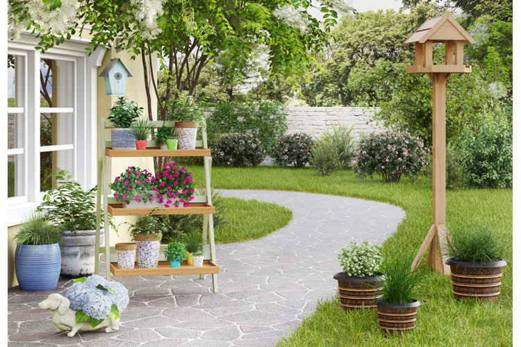 backyard with a stone path, brick wall, wooden bird house, and plant stand