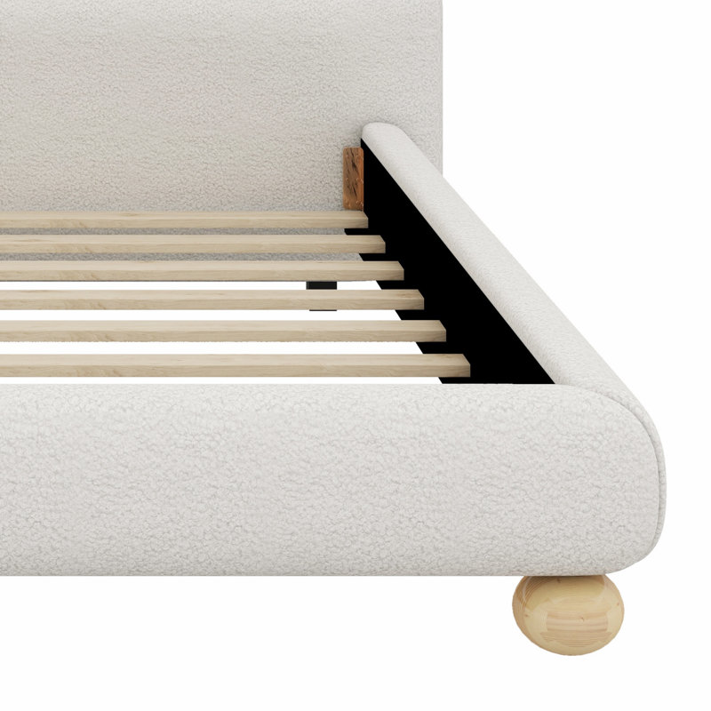 Lit tapissier contemporain à profil bas avec pieds ronds massifs et élégants pour la chambre à coucher