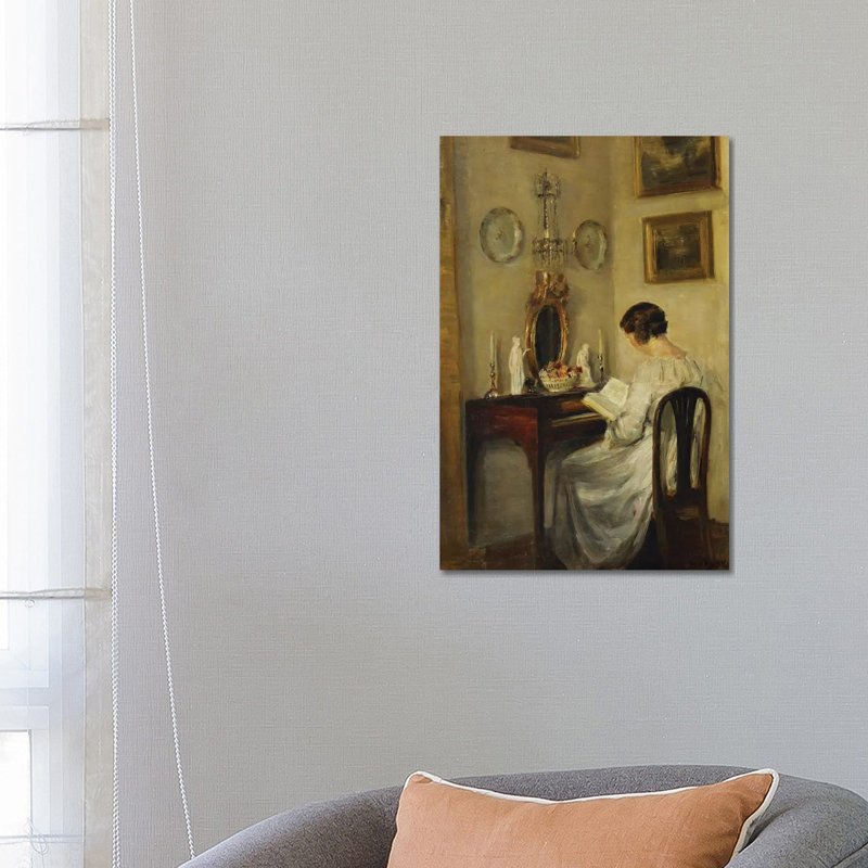 An Interior With A Girl Reading At A Desk by Carl Holsoe - Wrapped Canvas Gallery-Wrapped Canvas Giclée