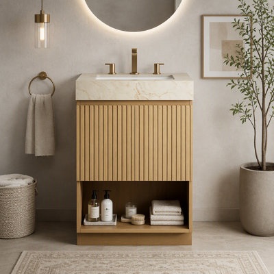 Meuble-lavabo autoportant de 61 cm (24 pouces) avec dessus en pierre frittée couleur crème veinée or, lavabo en céramique et trois trous prépercés pour robinetterie.