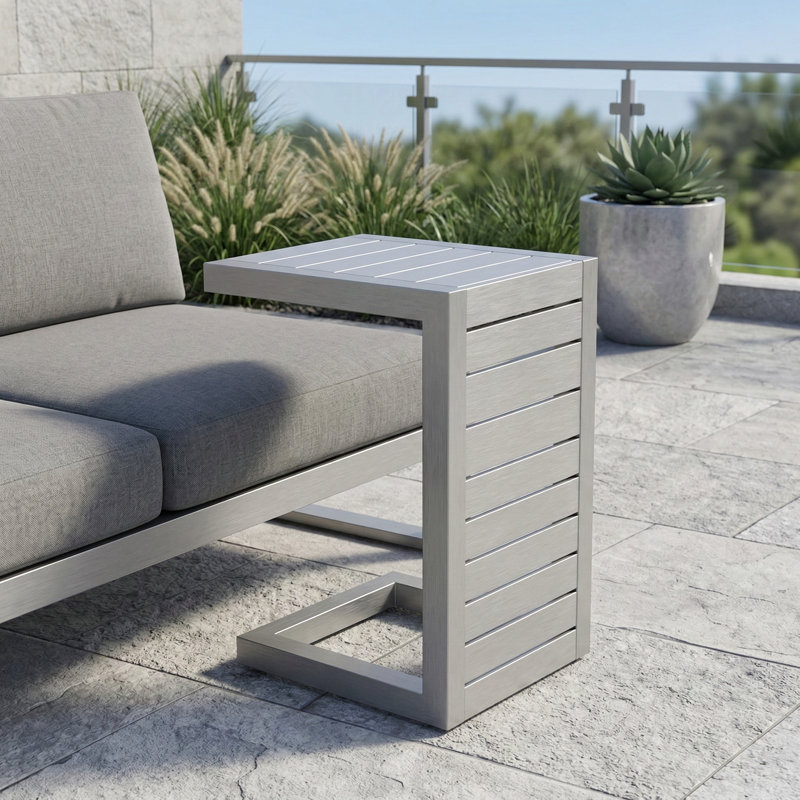 C-shaped end table from the Cape Coral Alu collection., Brown