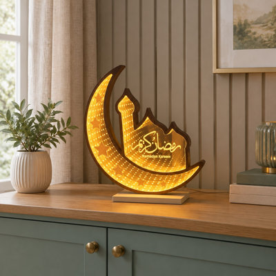 Pour la décoration intérieure pendant le Ramadan et l'Aïd, cette lampe de table islamique combine un croissant de lune et un motif de mosquée en DEL 3D avec une lampe miroir infini USB double face.