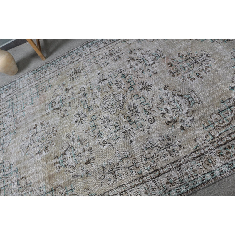 Elegant Faded Pattern on a Traditional Oriental Design Brings Vintage Turkish Area Rug to Life in Home Decor