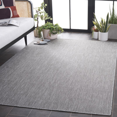 Tapis d'intérieur / extérieur de couleur unie Delmina Performance