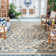 Arneshia Floral Tan/Blue Indoor/Outdoor Area Rug