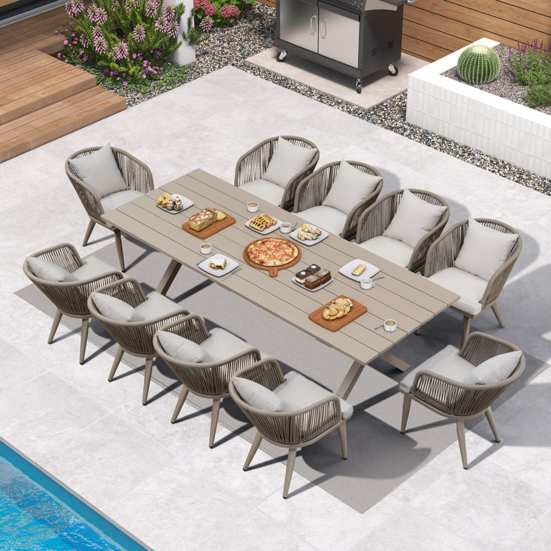 Ensemble repas pour 10 personnes en osier avec table rectangulaire, coussins et coussins inclus