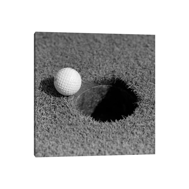 1950s Close-up Of Golf Ball On Green On Very Edge Of Cup by Vintage Images - Wrapped Canvas Print