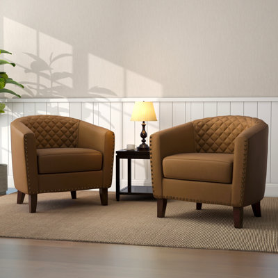 Fauteuil demi-tonneau capitonné en similicuir Edvardas