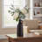 Minimalist Black Ceramic Vase, Slender Teapot Design, A Sophisticated Floral Arrangement For The Living Room Or Entryway.