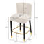 Le tabouret de 27 pouces au design moderne avec un tissu lisse de couleur claire et un repose-pieds circulaire avec une finition dorée crée un look sophistiqué et luxueux-153060563