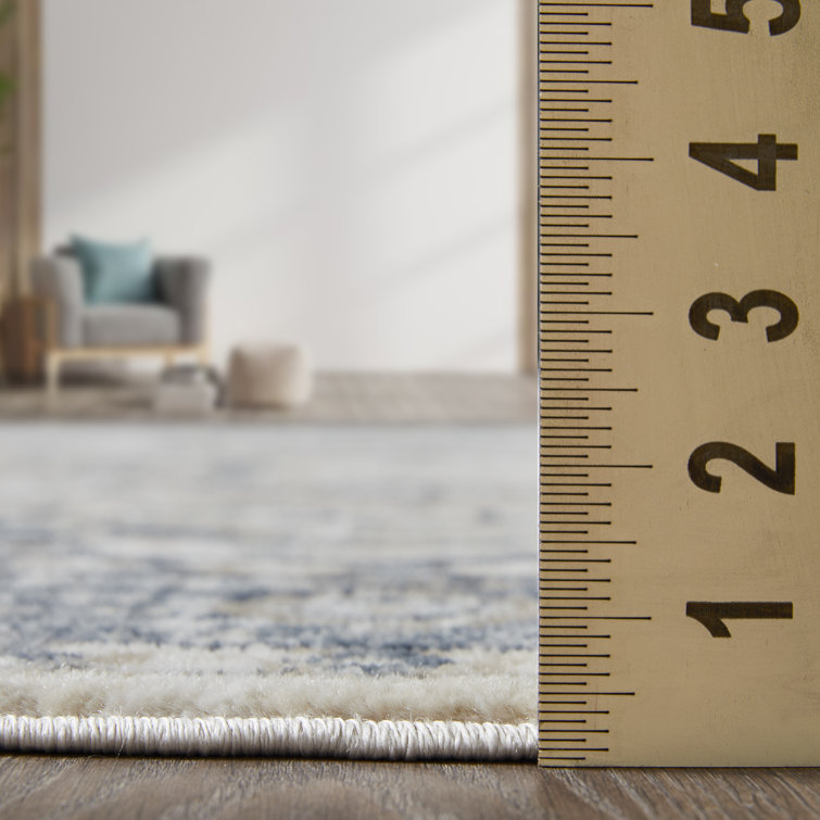 Aldijana Oriental Machine Woven Polypropylene Area Rug in Blue/Cream