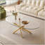 Table basse OVAL avec plateau en verre trempé et pieds dorés, moderne et durable pour l'élégance du salon