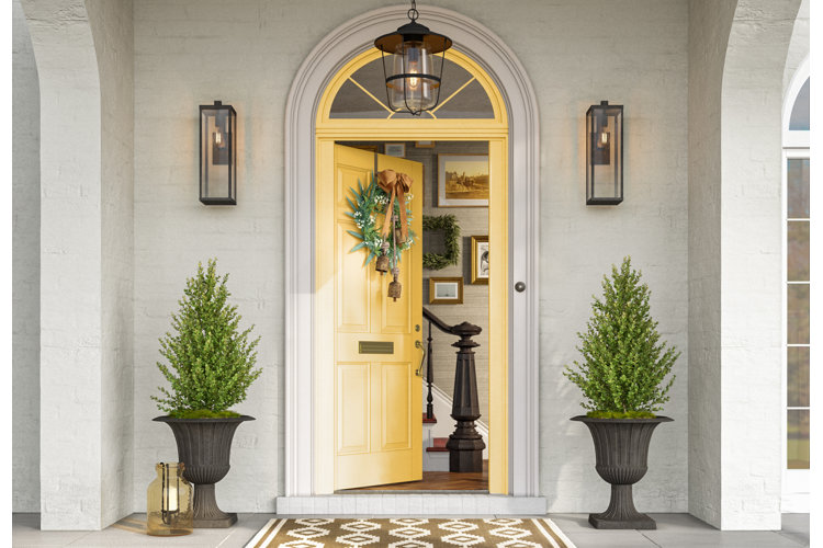 Yellow front door and classic porch