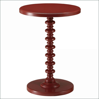 Table basse ronde en bois massif rouge, peu encombrante pour une surface pratique