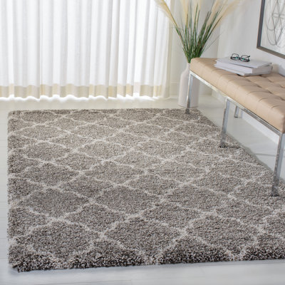 Tapis à poil long à motif géométrique gris