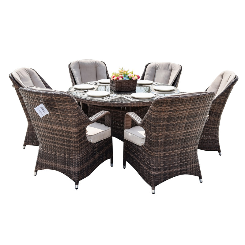 Algird 6 - Person Wicker Patio Dining Set with Round Table , Cushions Included, Brown, Beige