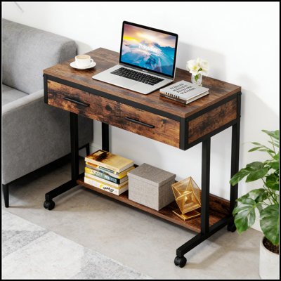 Bureau mobile compact à hauteur ajustable avec roulettes, parfait pour les espaces de travail et de vie flexibles.