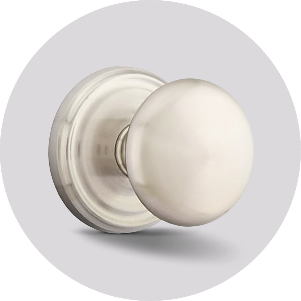 Satin nickel round door knob with a decorative circular backplate.