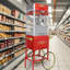 Machine à maïs soufflé avec chariot: Cette machine à maïs soufflé sur roulettes combine un style antique avec des caractéristiques modernes. Le chariot comprend des roues de style vélo de 16 po et une armoire avec un espace de rangement pour le maïs soufflé