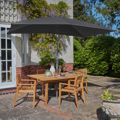 Sirmans 4 - Person Wood Patio Dining Set with Extendable Rectangular Table
