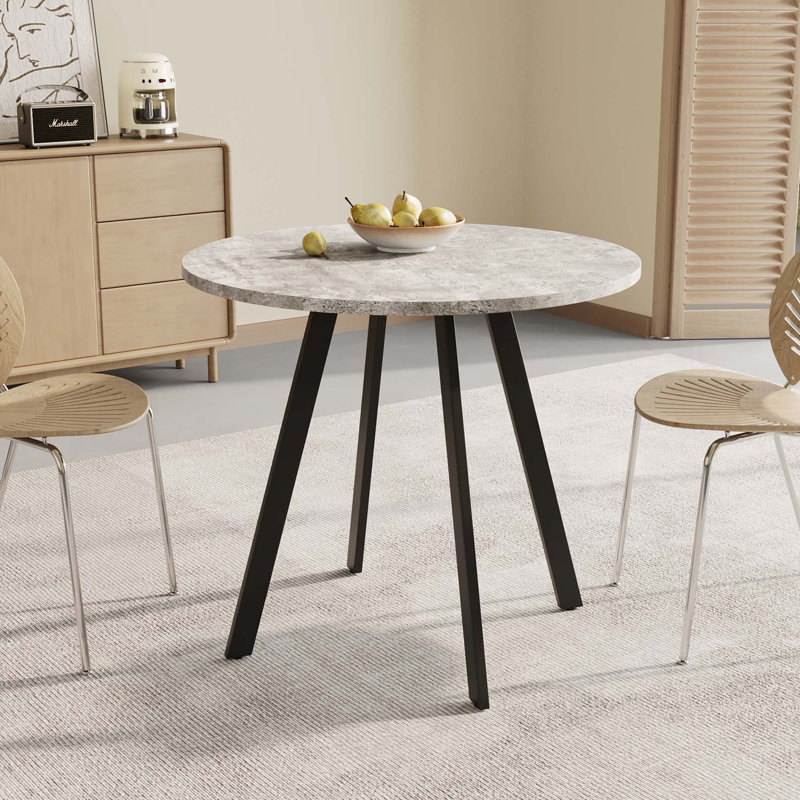 Versatile Circular Dining Table with Industrial Appeal for Various Settings