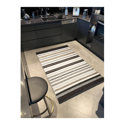 Tapis beige lavable à la machine à motif géométrique