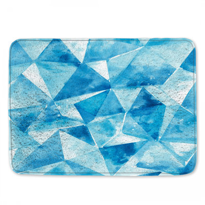 Tapis de bain bleu à triangles géométriques
