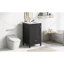 -inch bathroom vanity with sink, soft-closing door, storage rack, and drawer, compact and sleek design in black.