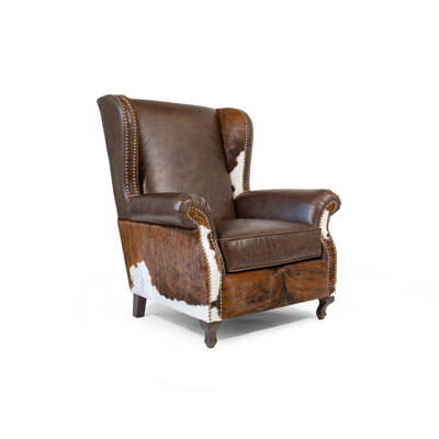 Fauteuil à oreilles en cuir avec détails en peau de vache