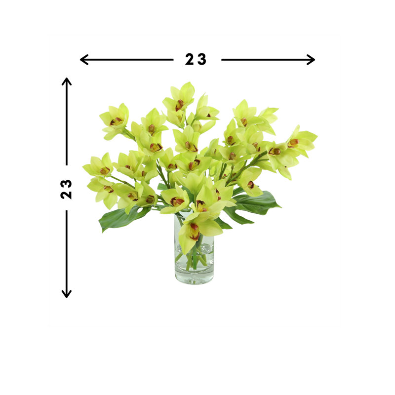 Orchids And Leaves In A Glass Vase