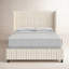 Tilly upholstered bed in cream and grey striped fabric with a wingback headboard.