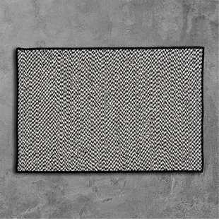 https://assets.wfcdn.com/im/84256164/resize-h310-w310%5Ecompr-r85/2204/220405271/outdoor-houndstooth-tweed-black-area-rug.jpg