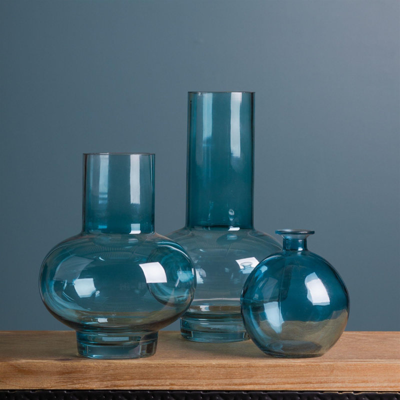Ensemble de deux vases de table ronds en verre turquoise