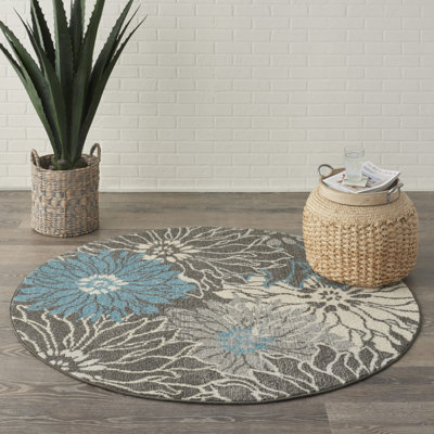 Tapis bleu et gris à motif floral