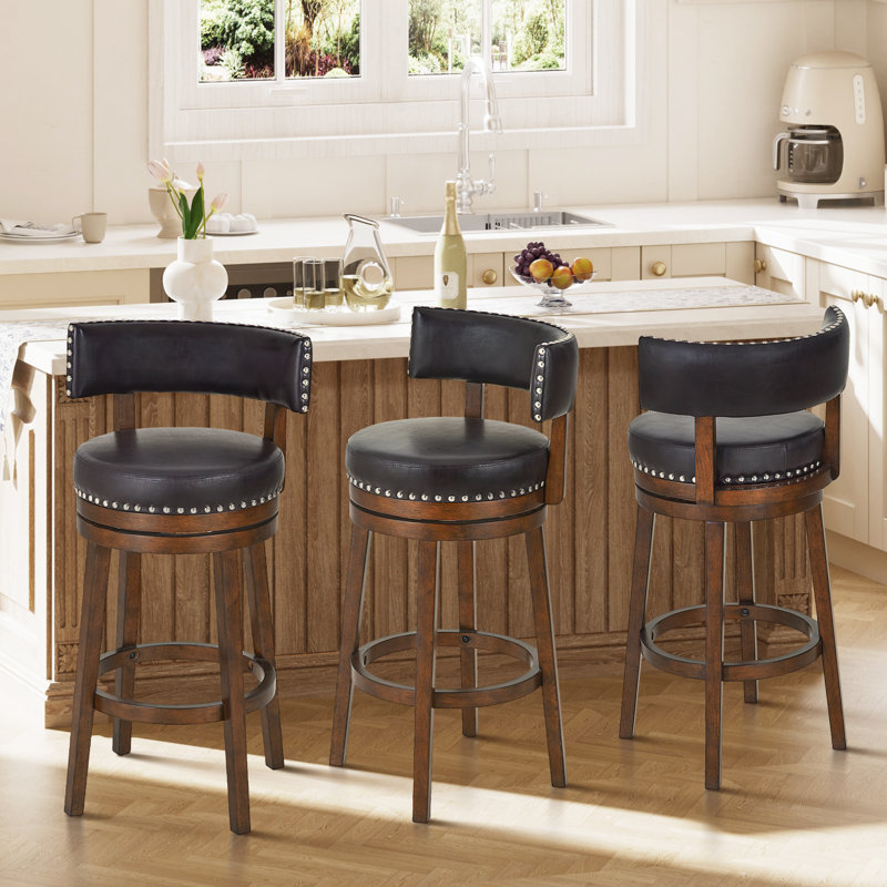 Tabouret de comptoir pivotant rembourré de 61 cm (24 po), pivotant à 360°, avec assise et dossier rembourrés, structure en bois massif, repose-pieds et garniture cloutée.